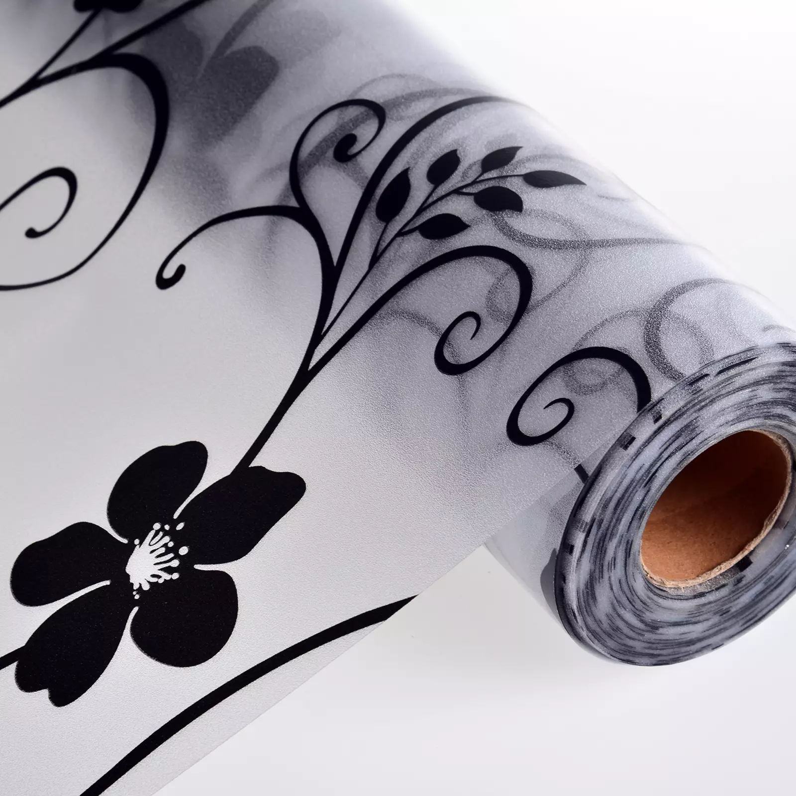 Visual of frosted glass film printing services, showing a decorative or branded design applied on a glass panel or office partition, with a semi‑opaque, etched‑like frosted effect that maintains light transmission while adding privacy and visual branding.