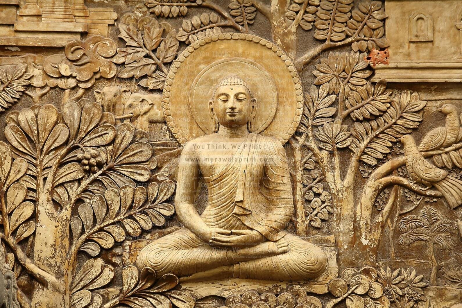 Buddha statue in meditation with decorative wall design